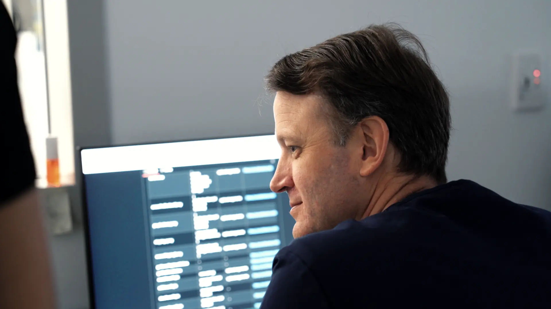 IPGC radiologist reviewing a patient worklist on screen