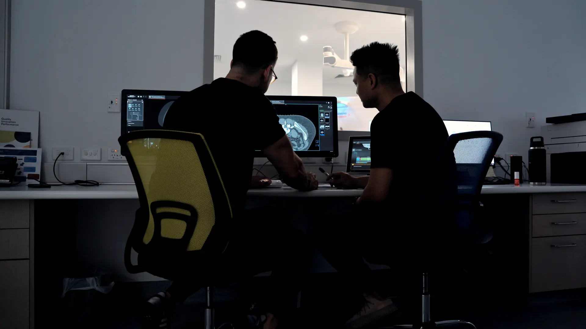 IPGC specialists reviewing CT studies in the clinic control room